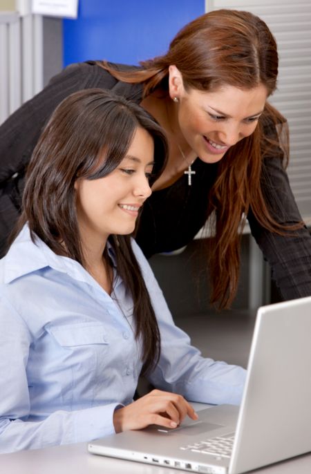 Business women with a computer in an office