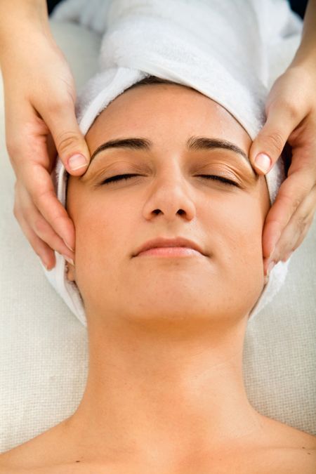 Woman at a spa having a massage on her face