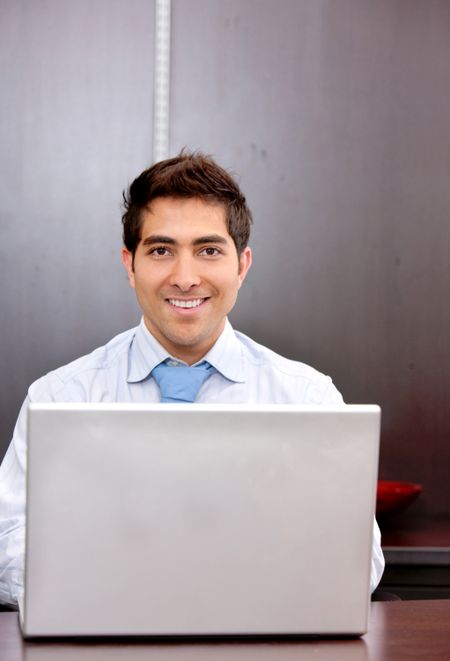 business man with a laptop at an office