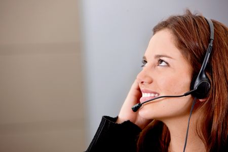 Customer support operator at an office smiling