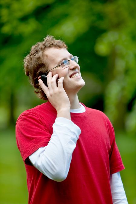 Man talking on the phone outdoors and smiling