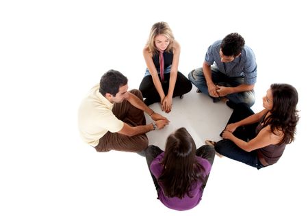 Casual group of people sitting on the floor isolated