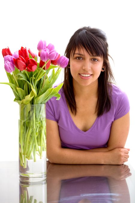 Girl with some flowers isolated on white