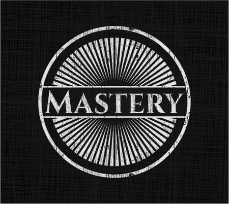 Mastery chalkboard emblem written on a blackboard
