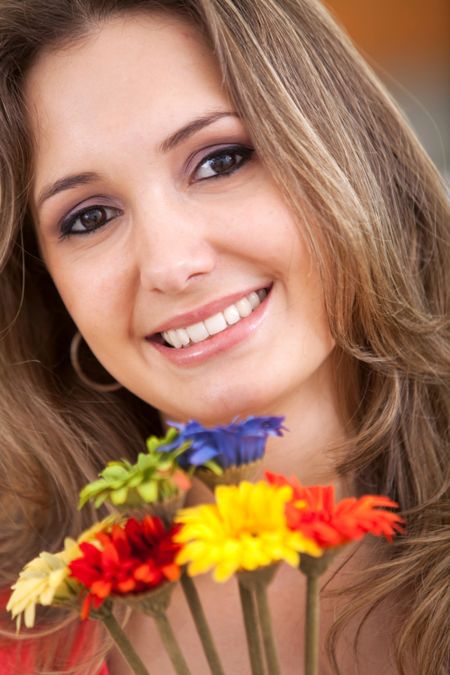 Beautiful woman portrait with flowers smiling