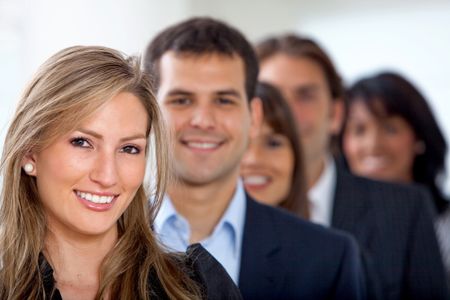 business team in an row - smiling in an office