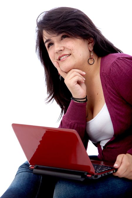 Thoughtful student on a laptop - isolated on white
