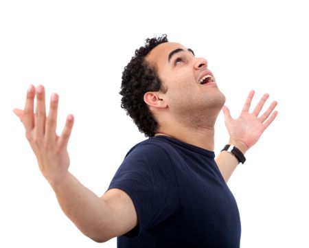 casual man with his arms up representing his success isolated over a white background