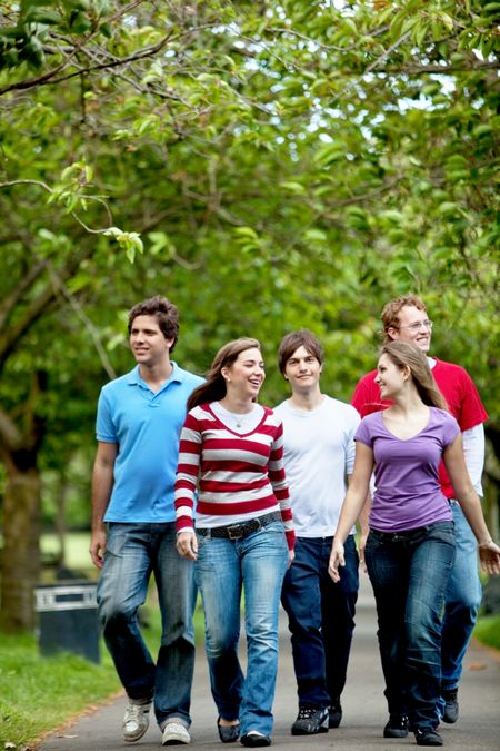 Group of casual young people walking outdoors