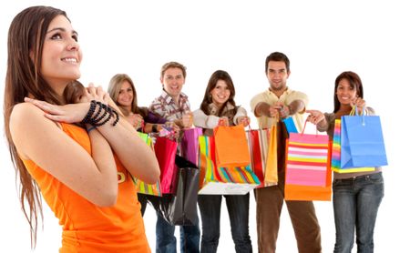 Group of happy shoppers with shopping bags isolated