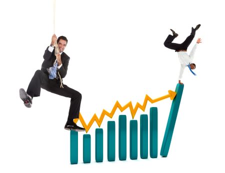 Business people over a growth graphic isolated over white