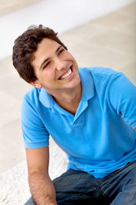 casual happy man portrait smiling at home