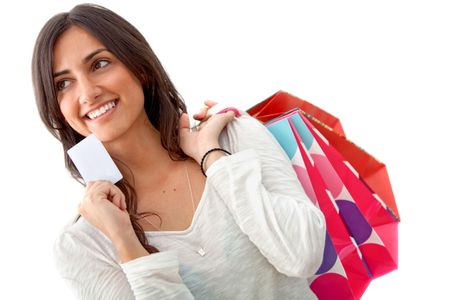 Beautiful woman with shopping bags isolated on white