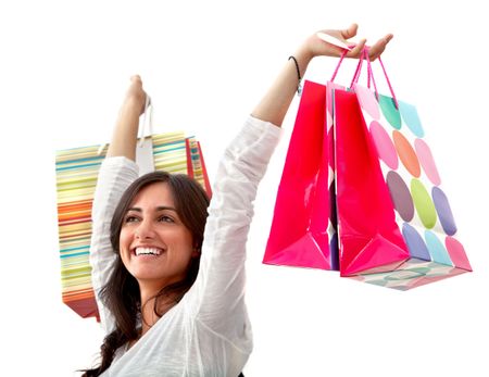 Happy woman with shopping bags isolated over a white background