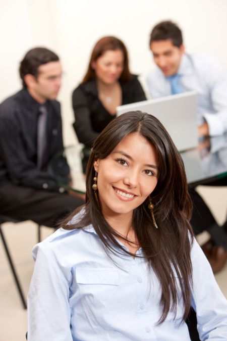 Business woman portrait smiling in an office