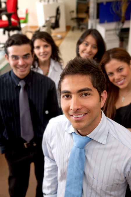 group of business people smiling in an office
