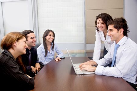 Group of business people on a laptop in an office