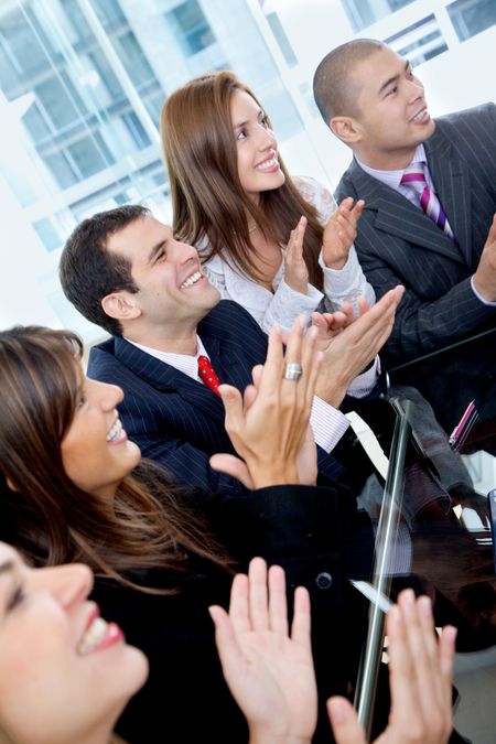 business team clapping a good presentation in an office