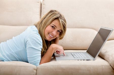 Casual girl working on a computer from home