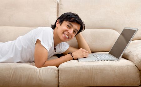 Casual man working on a computer from home