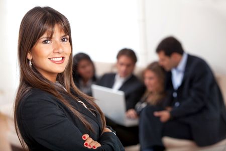 business woman portrait at an office smiling