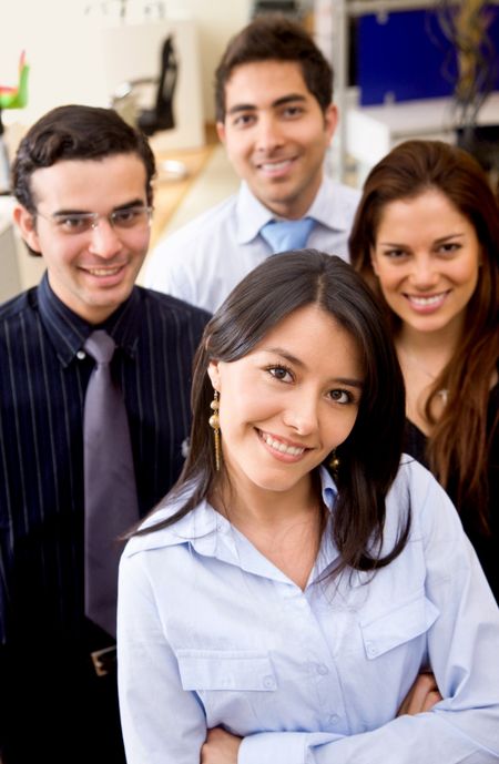 Portrait of a business team smiling at an office