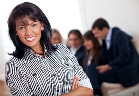 Business woman portrait at an office smiling