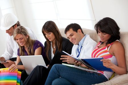 Group of people with different professions sitting on a sofa