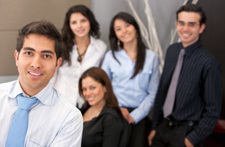 Group of young executives smiling at an office