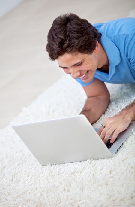 Young man working with a computer and smiling