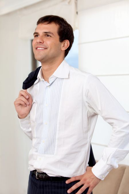 Casual business man portrait at home smiling