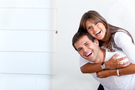 happy young couple portrait smiling at home