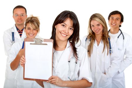 female doctor displaying a notepad with her team behind her - isolated over white