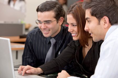 small business team in a meeting on a laptop computer at the office