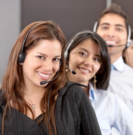 customer services representatve team smiling - business concepts