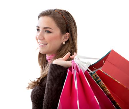 beautiful girl with shopping bags - isolated over a white background