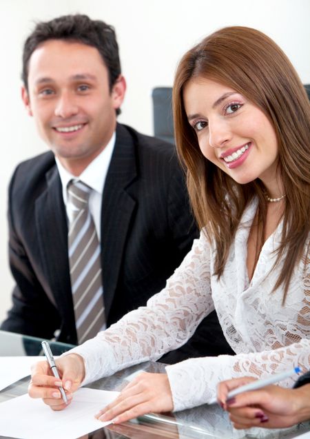 Businesswoman with her partner working in a office