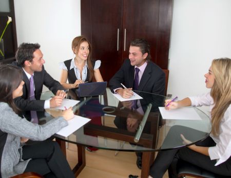 Group of business people on a laptop in an office