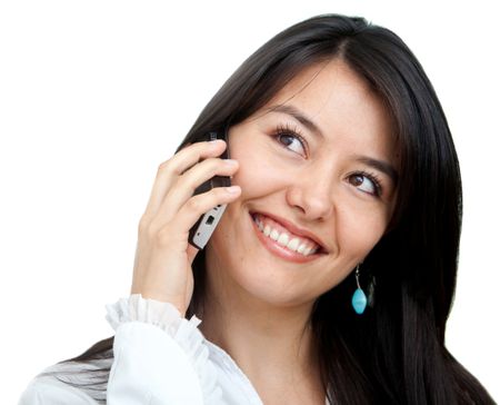 business woman smiling and talking on a mobile phone - isolated over a white background