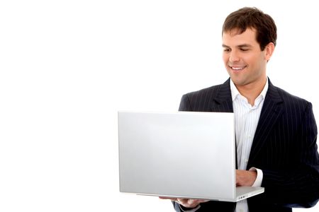 business man looking happy on a laptop in his office