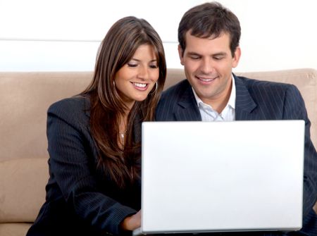 business partners on a laptop computer in an office