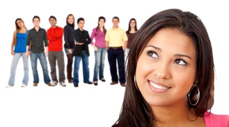 Pensive woman with a group of people behind isolated over a white background