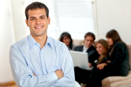 Young male executive smiling at the office