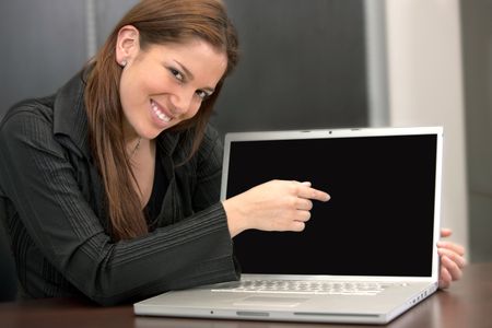Business woman pointing at the screen of a computer