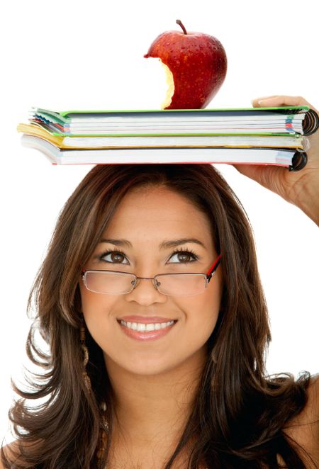 Pensive female student with notebooks and an apple over her head isolated
