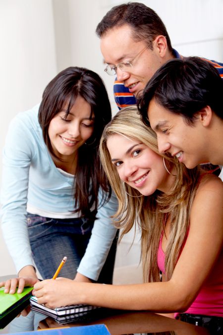 Group of students working at home and smiling