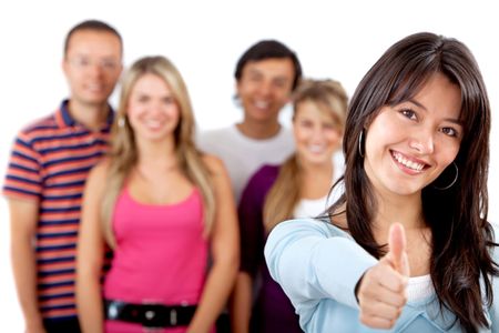 Woman with thumbs up and a group behind isolated over a white background