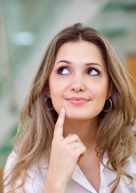 Thougthful young business woman at the office