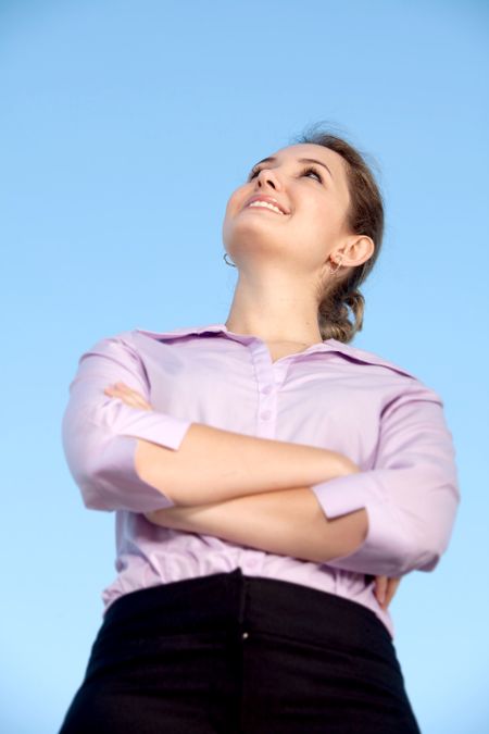 Friendly business woman portrait smiling and looking up