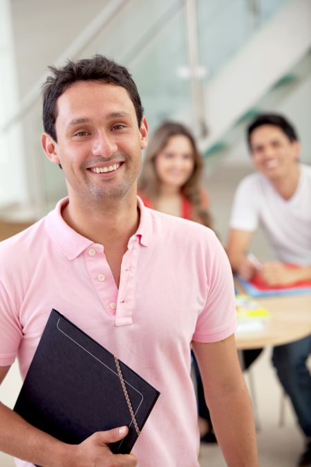 male student studying at home with a notebook